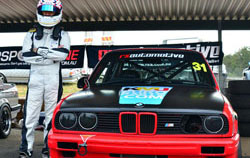 Red BMW E30 in pits